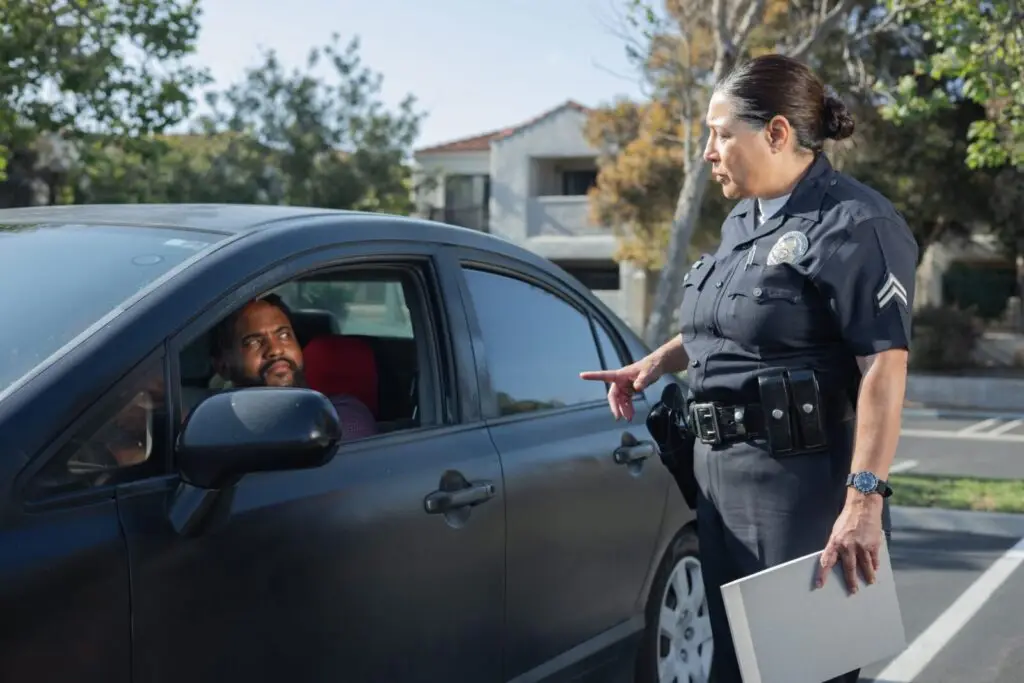 Police officer speaking with a driver during a traffic stop, when Maryland permit holders must have their permit with them