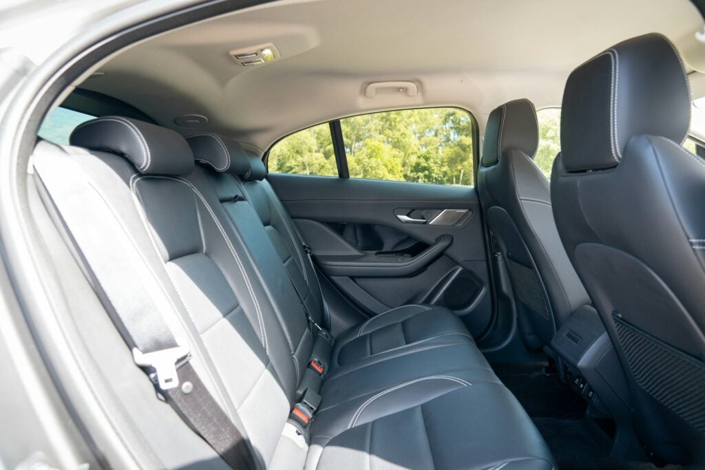 Back row of car seats, where child-seat anchors sit in the seat crease