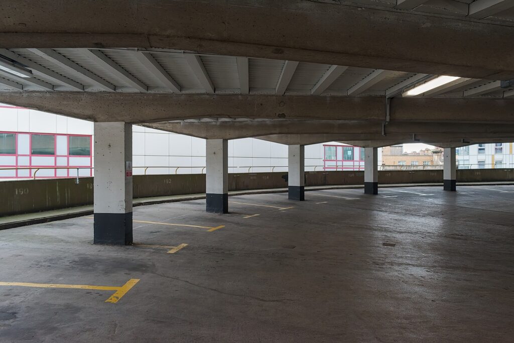 Rows of parked cars inside a city parking garage