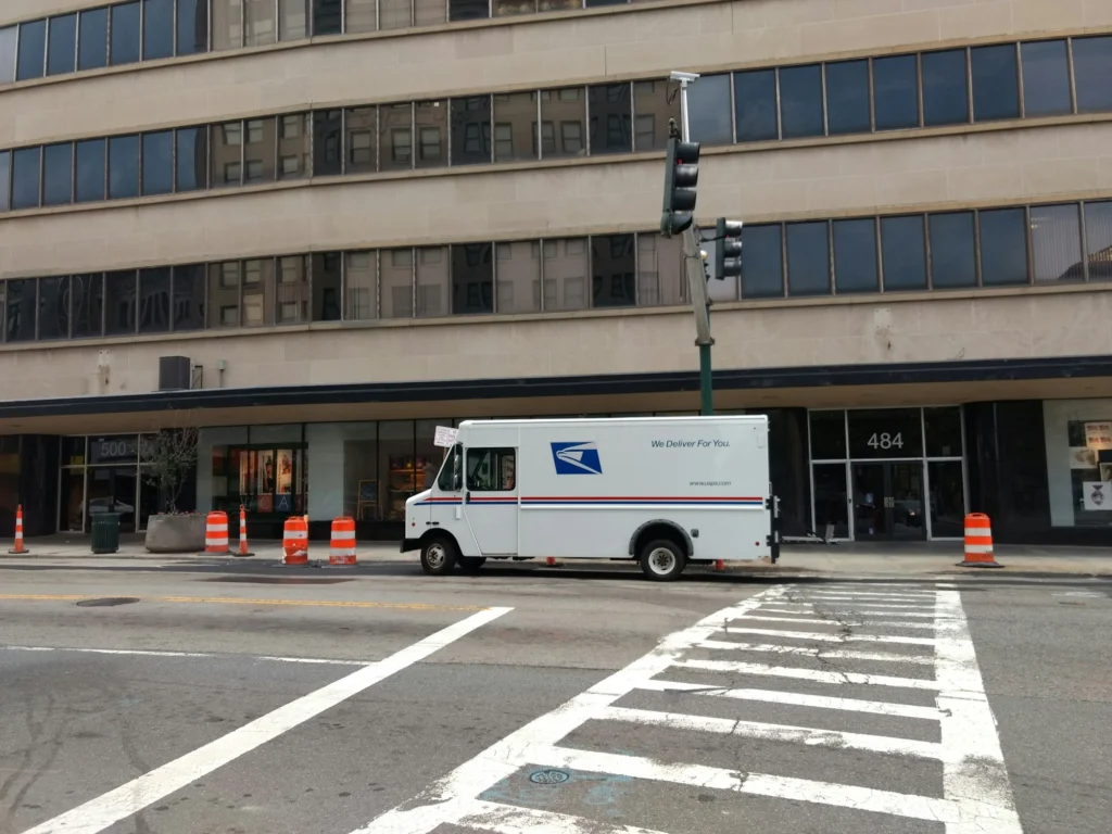 U.S. Postal Service truck parked on a city street